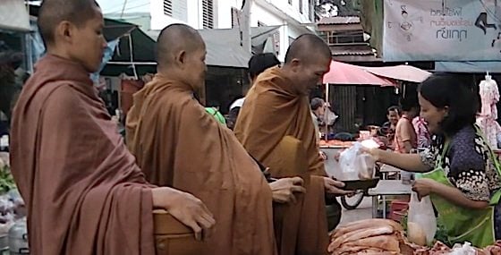 Buddha Weekly 2Monks Buddhist receiving alms gives opportunity for lay believers to practice generosity