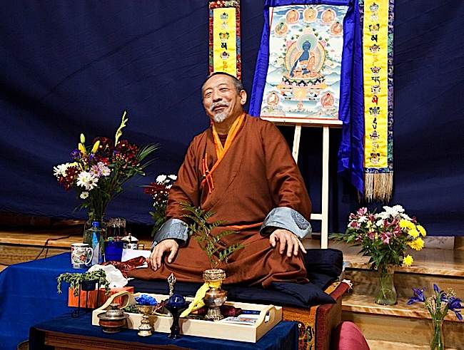 His Eminence Zasep Tulku Rinpoche giving teachings on Medicine Guru to a large audience.