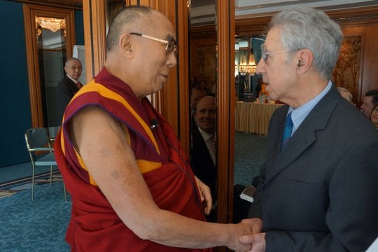 Alexander Berzin greets the Dalai Lama.