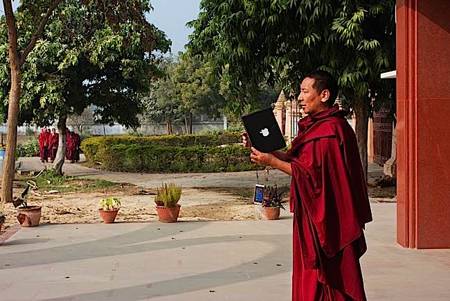 Zasep Rinpoche, during an interview, said: "Even some monks, now, instead of holding malas and doing mantras, they have their phones in hand, sending messages, text messages." Above: monk with Ipad.