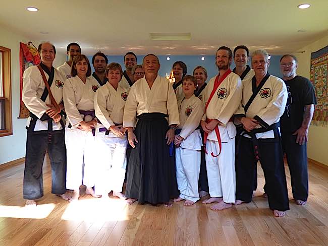 Zasep Rinpoche (centre) demonstrates a well-rounded relationship with his students. Here, his martial arts students from Australia came for one of the five working retreats (Karma Yoga) to help build a new retreat temple in Nelson B.C. Rinpoche is also an Aikido practitioner and practices Laido sword art.