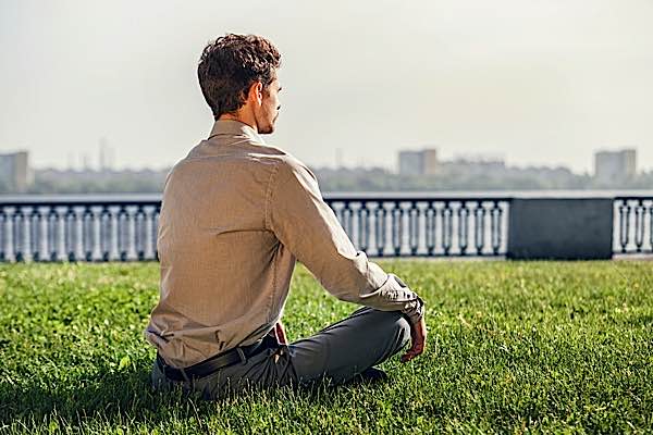 Buddha Weekly Man in business suit meditation Buddhism