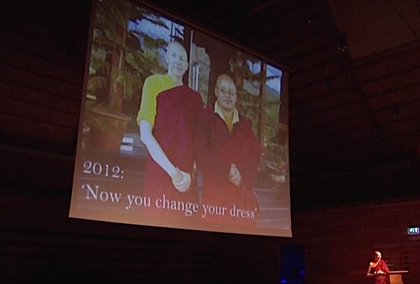 Buddha Weekly Emma Slade at Ted Talks and her Teacher in 2012 in background Buddhism