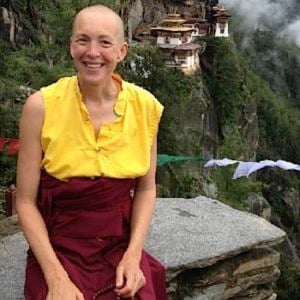 Buddha Weekly Emma Slade in front of temple mountains Buddhism