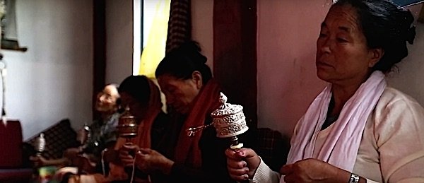 Buddha Weekly Ladies spin prayer wheels at monestary in sikkhm Buddhism