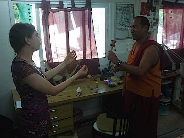 Buddha Weekly Lama Tenzin tries prayer wheel at Galgamani Buddhism