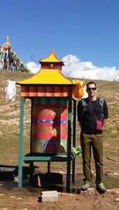 Buddha Weekly Shea Witsett of The Prayer Wheel Shop at a water prayer wheel Buddhism