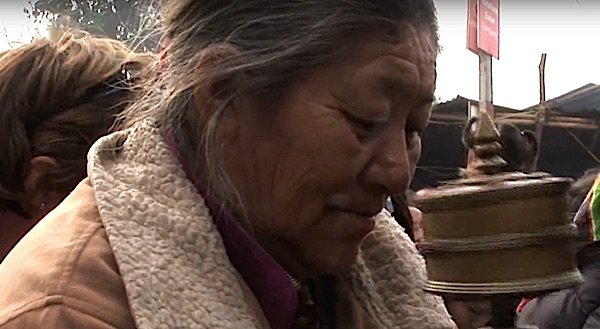 Buddha Weekly Tibetan Man with Prayer Wheel in Bodhgaya Buddhism