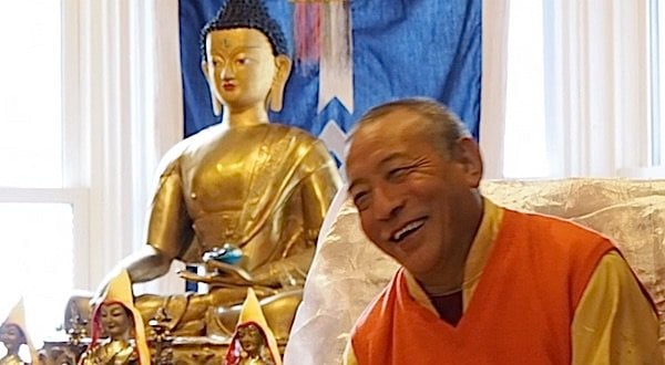 Buddha Weekly Zasep Tulku Rinpoche laughing at Gaden Choling in front of altar Buddhism