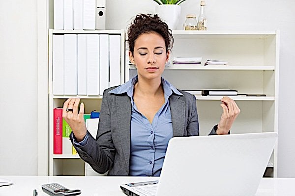 Buddha Weekly woman meditating at work Buddhism