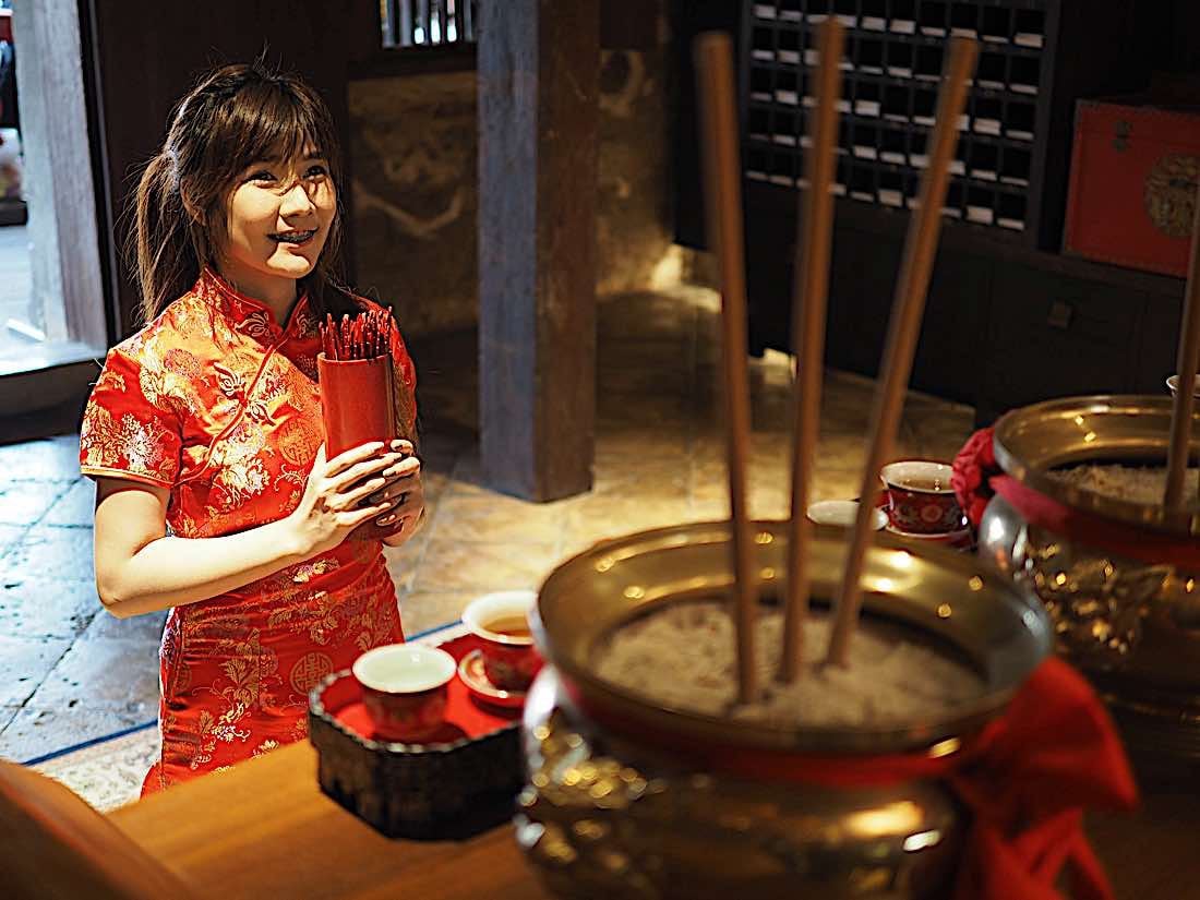 Buddha Weekly Buddhist using bamboo Chien Tung sticks at Chinese New Year in Buddhist Temple Buddhism