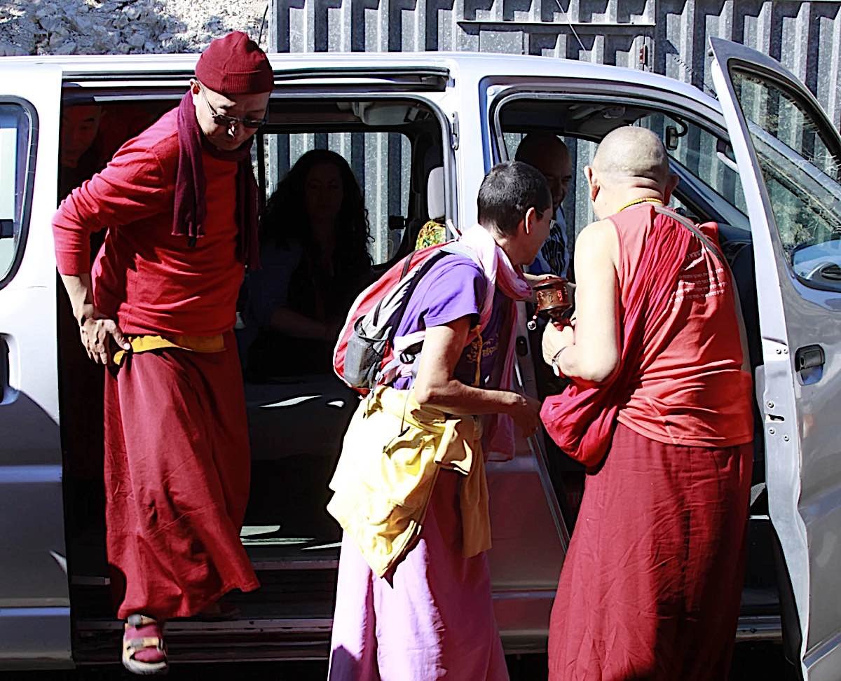 Buddha Weekly Garchen Rinpoche and entourage getting into the van thanks to Rinpoche they arrived safely after a near miss with a truck on the highway Buddhism