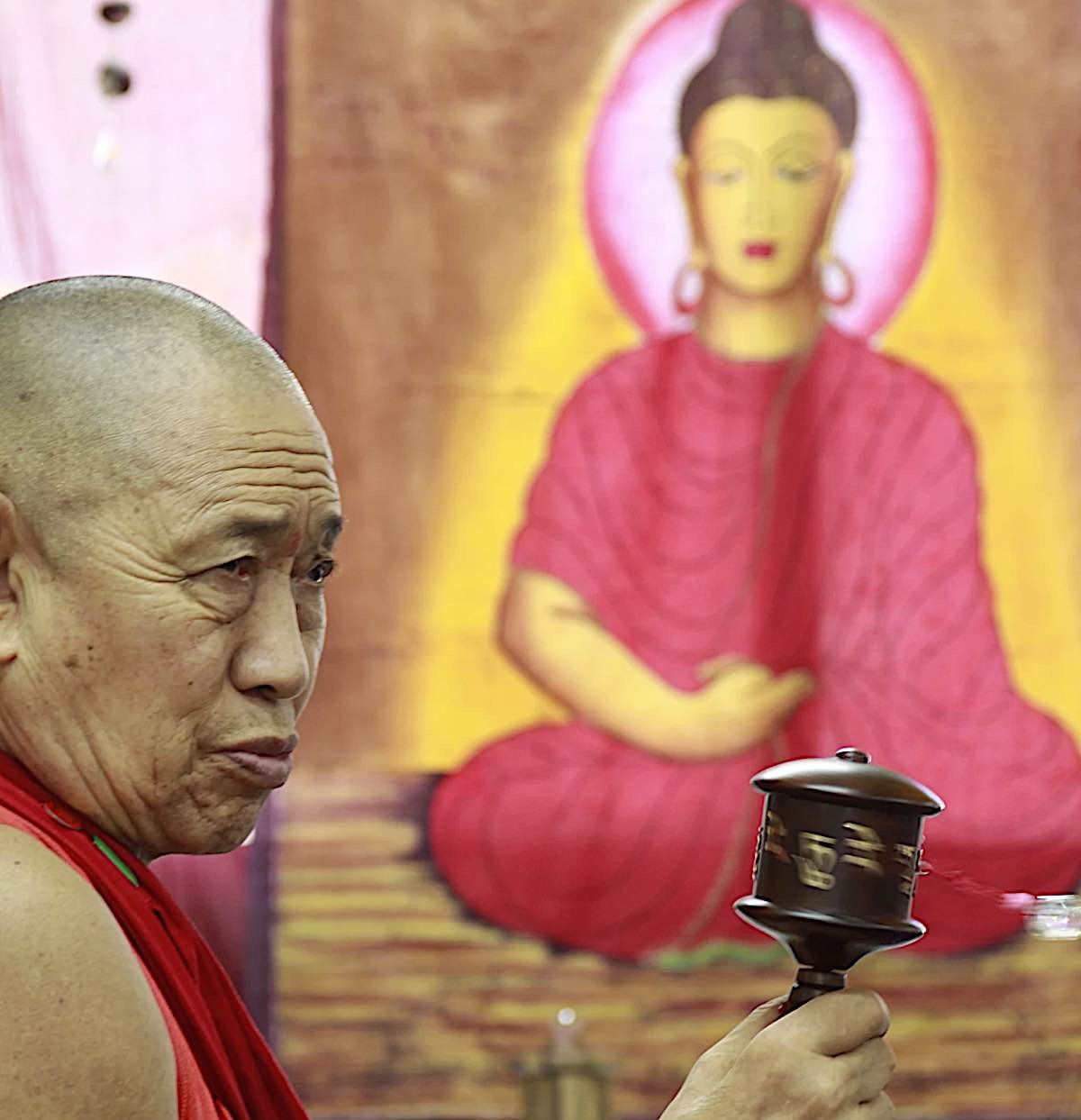 Buddha Weekly H.E. Garchen Rinpoche in front of Buddha painting at the workshop of Holy Land Prayer Wheels in Israel Buddhism