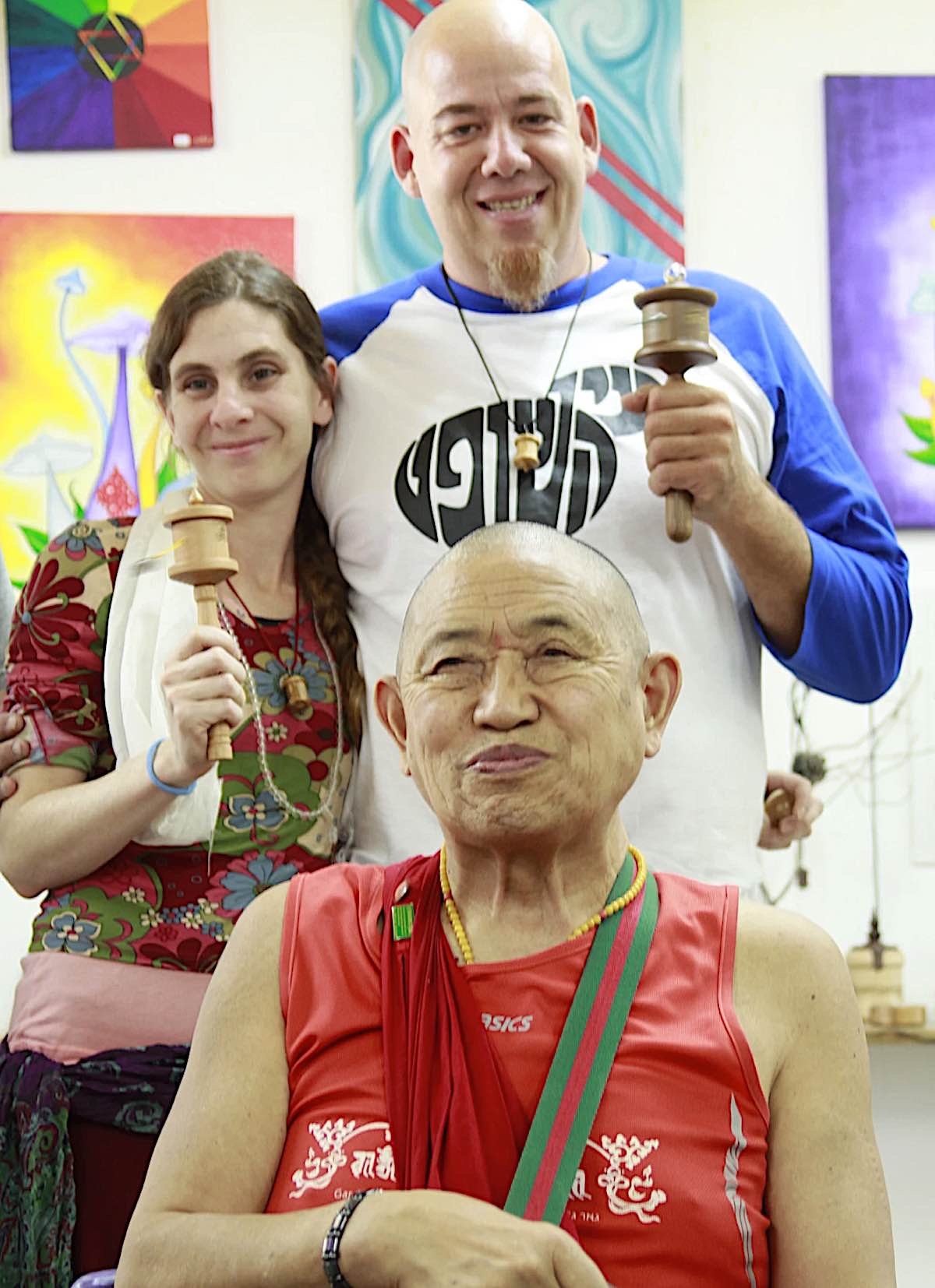 Buddha Weekly H.E. Garchen Rinpoche with Micha and Ayelet Strauss at the workshop of Holy Land Prayer Wheels in Israel spinning wheels Buddhism