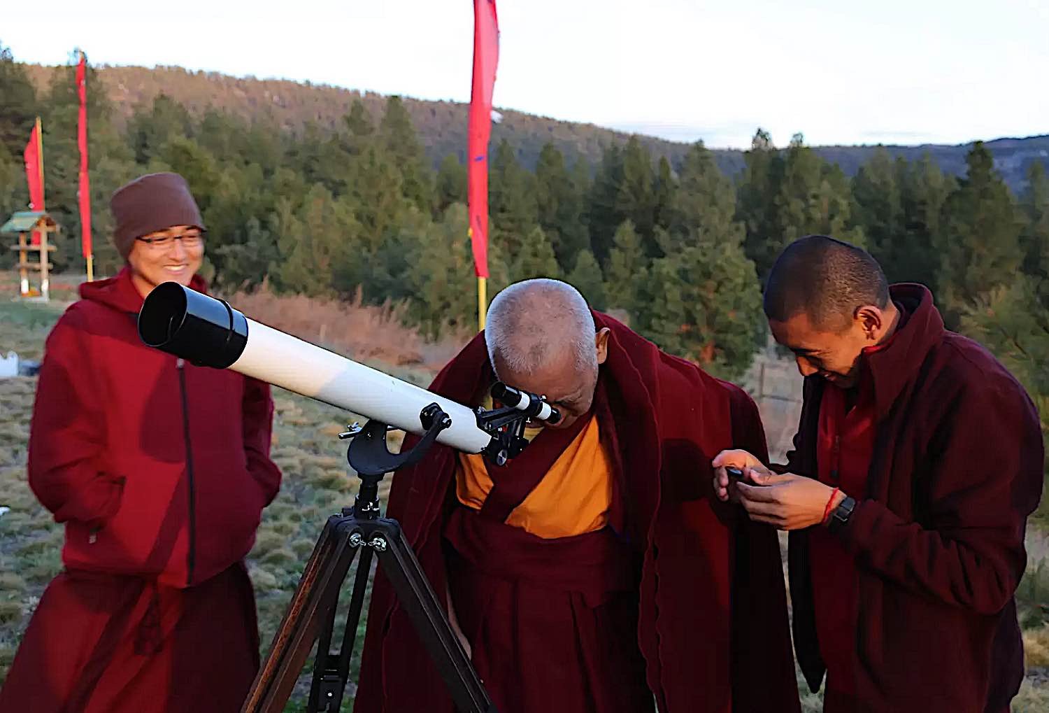 Buddha Weekly Lama Zopa Rinpoche gazes through a telescope FPMT Buddhism