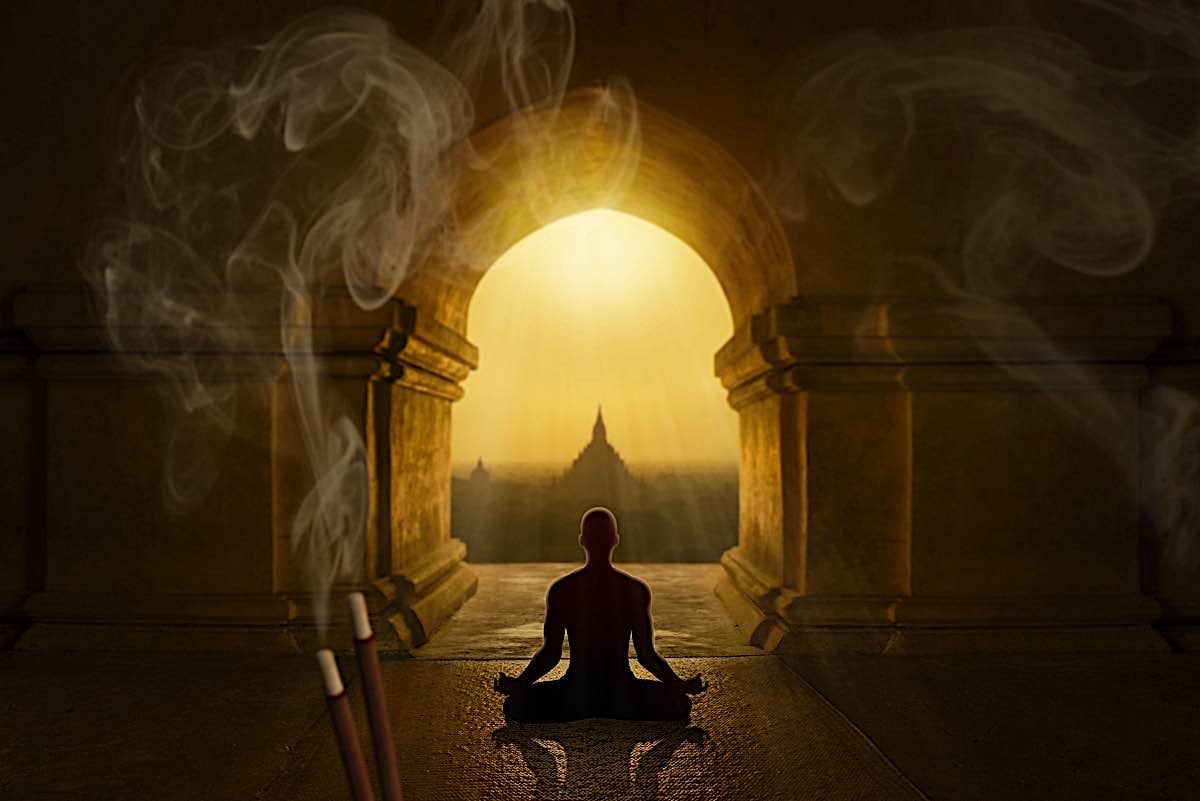 Buddha Weekly Man meditating incnense sticks dreamstime xxl 153753394 Buddhism