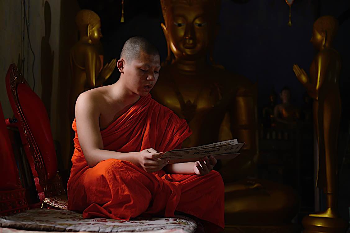 Buddha Weekly Monk chanting mantras in the morning at temple Buddhism