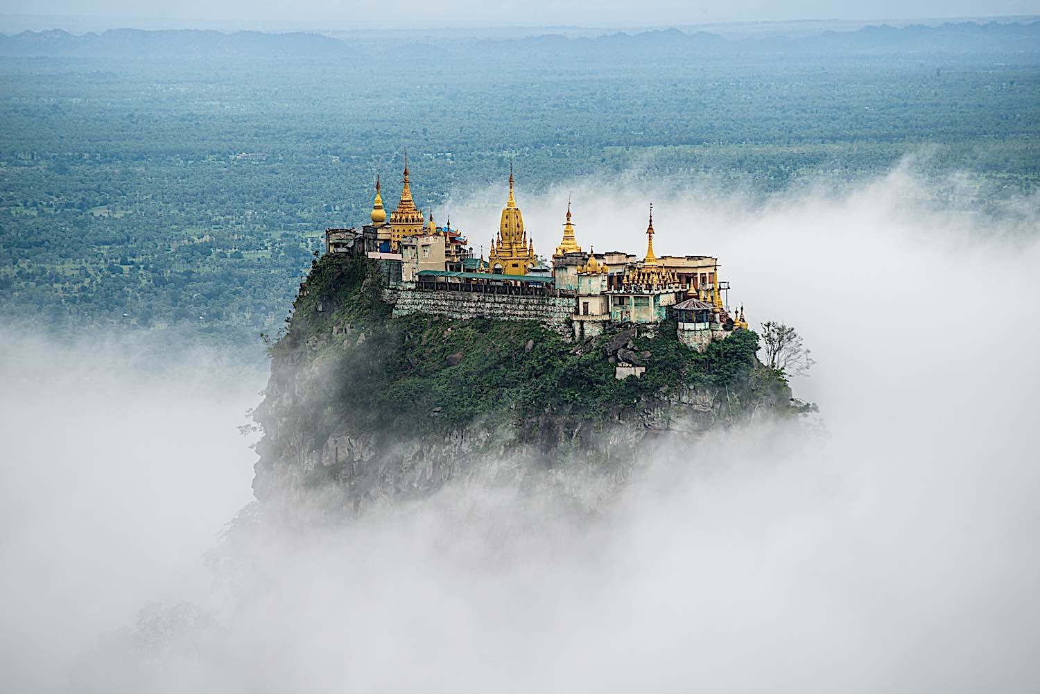 Buddha Weekly Mount Popa with fog the old volcano in Myanmar home of the Nat Burma Ghost Buddhism