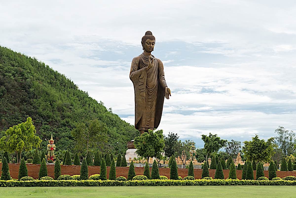 Buddha Weekly Phra Buddha Metta Pracha Thai Buddha Statue at Kanchanaburi Mudra of Banishing Fear Abhaya in right hand and Giving and Salvation Varuda Mudra in other Thailand dreamstime 60970212 Buddhism