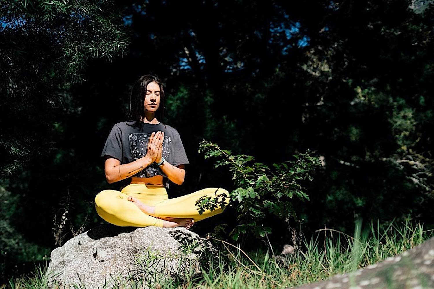 A student meditating. Research indicates meditation has numerous academic, intelligence and health benefits for students.