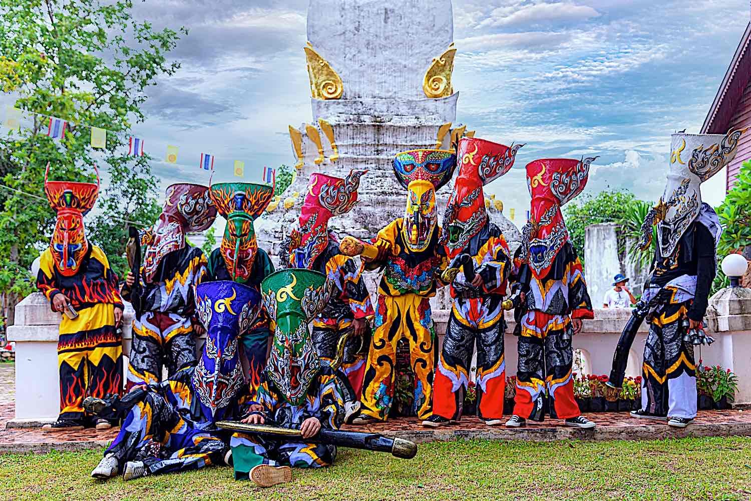 Unidentified men wear ghost costumes in Phi Ta Khon Festival is a masked procession celebrated by Buddhist at Dan Sai district, Indonesia.