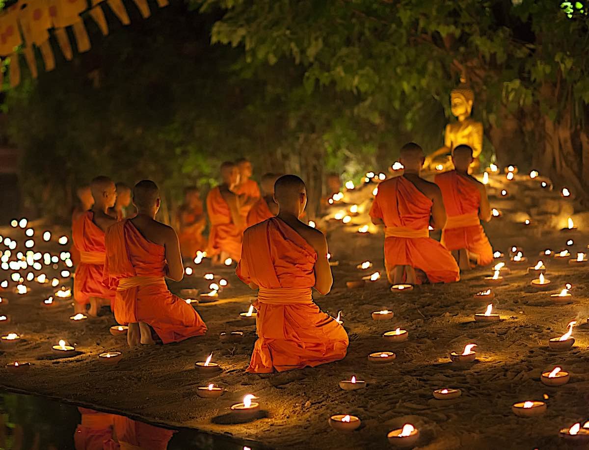 BuddhaWeeklyBuddhist monk meditating at waterfall dreamstime_xxl