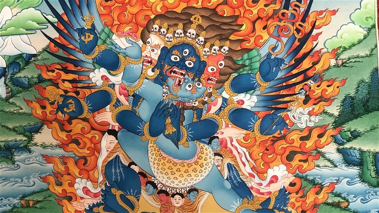 Vajrakilaya close up in his wrathful form with three faces blue, whuite and red.