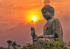 Amoghasiddhi Buddha. The "Tian Tan" or "Giant Buddha" at Po Lin Monastery Ngong Ping in Hong Kong is Amoghasiddhi, held his right hand up in Abhaya Mudra. This huge statue is on top of a mountain, with Amoghasiddhi's gaze looking out on the Samsaric world protectively.