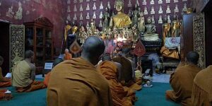 Buddha Weekly Chanting and meditating with monks Laos Buddhism custom crop