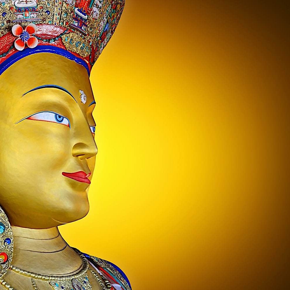 Face of a loving friend — Maitreya Buddha.