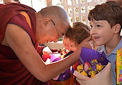 The Dalai Lama with children. Even though the Dalai Lama is very science-oriented, his priority clearly is Dharma, the teachings, and most especially compassion and love for all beings.