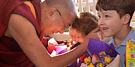 The Dalai Lama with children. Even though the Dalai Lama is very science-oriented, his priority clearly is Dharma, the teachings, and most especially compassion and love for all beings.