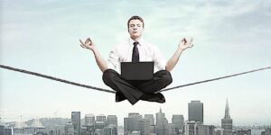 Buddha Weekly Feature Image Dreamstime man on Meditation tight rope Buddhism custom crop