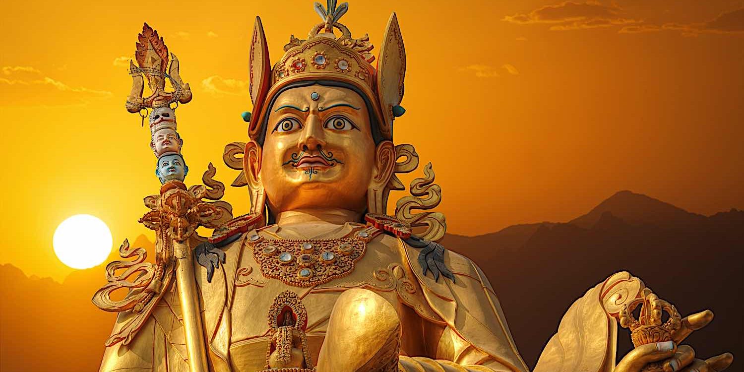 Outdoor statue of Guru Rinpoche Padmasambhava in Nepal at sunset.