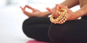 Buddha Weekly Mala mantra meditation dreamstime xxl 56393397 Buddhism custom crop