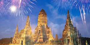 Buddha Weekly New Year Celebrating the New Year in Thailand with fireworks at Wat Chai Watthanaram Buddhist temple Thailand Buddhism custom crop
