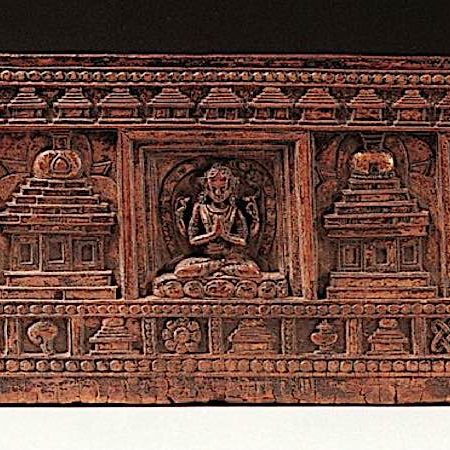 A Sutra cover with embossed images of the Three Great Ones: Manjushri centre, Avalokiteshvara (our left) and Vajrapani (our right).