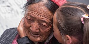 Buddha Weekly Tibetan older woman and child during Hemis Festival in Ladakh North India dreamstime 57350980 Buddhism custom crop