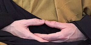Hand mudra seated meditation.