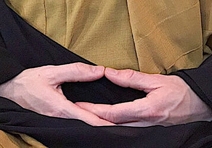 Hand mudra seated meditation.