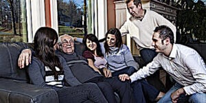 Family looking after elder parent at home. Filial responsibility is taken seriously among most Buddhists.